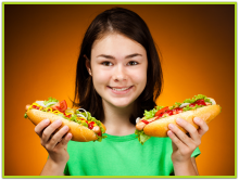Happy girl with hot dogs